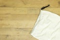 White drawstring bag on wood table. Fabric cotton small bag. Royalty Free Stock Photo