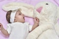 Newborn baby girl with her bunny Royalty Free Stock Photo