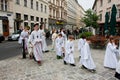 White dressed children on the road to the Catholic Church Royalty Free Stock Photo