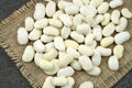 White dried beans on sackcloth. Royalty Free Stock Photo