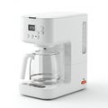 White drip coffee maker with a digital clock display showing 12:00. Features include Royalty Free Stock Photo