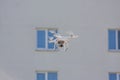 White Drone Flying Above The Building