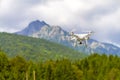 White drone flying above mountains Royalty Free Stock Photo