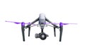 White drone quadrocopter with photo camera flying in the blue sk