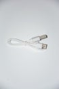 White dual head USB data cable, close-up of a simple pure white background Royalty Free Stock Photo
