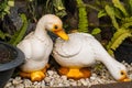 White ducks statue decorated in the green garden Royalty Free Stock Photo