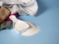 white dustpan with baby washing powder