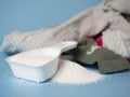 White dustpan with baby washing powder