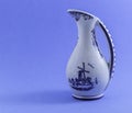 White Dutch vase with blue details with windmills and small decorations Royalty Free Stock Photo