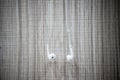 White earphone hanging on the wooden table