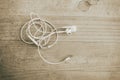 White earphone on wooden background Royalty Free Stock Photo