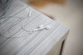 White earphone on the wooden table