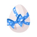 White Easter egg with blue polka dot bow. Beautiful cartoon vector egg for easter cards, banners, posters and other Royalty Free Stock Photo