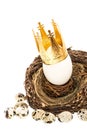 White easter egg with golden crown decoration