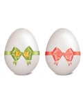 White easter eggs with bows and ribbons on white background