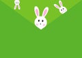 White easter rabbits on green envelope background.