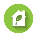 White Eco friendly house icon isolated with long shadow. Eco house with leaf. Green circle button. Vector Royalty Free Stock Photo