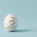 A white egg with gold decorative lines and dots on a light blue background Generative AI Royalty Free Stock Photo