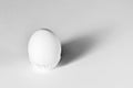 White egg on a white isolated background with shadow. Ingredient.Healthy food.Easter Royalty Free Stock Photo