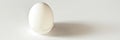 White egg on a white isolated background with shadow. Ingredient.Healthy food.Easter Royalty Free Stock Photo