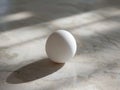 White egg on marble surface Royalty Free Stock Photo