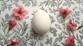 Decorative white egg surrounded by pink flowers on patterned background Royalty Free Stock Photo