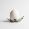 White Easter Egg on Silver Stand Isolated on Grey Background Royalty Free Stock Photo