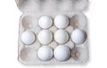 White eggs in a carton box on white background Royalty Free Stock Photo