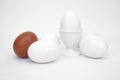 White eggs, a cup, brown egg, contrast, symbol, white Royalty Free Stock Photo