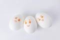 White eggs with different smilies