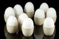 White eggs in egg-cups on black 3 Royalty Free Stock Photo