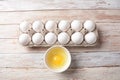 White eggs and egg yolk .Store bought chicken eggs in gray carton Royalty Free Stock Photo