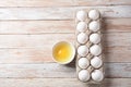 White eggs and egg yolk .Store bought chicken eggs in gray carton Royalty Free Stock Photo