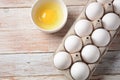 White eggs and egg yolk .Store bought chicken eggs in gray carton Royalty Free Stock Photo