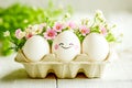 White eggs with flowers in egg carton Royalty Free Stock Photo