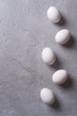 White eggs on a gray concrete table. Easter photo concept. Royalty Free Stock Photo