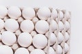 White eggs of a hen in harmless, cardboard packing on a white background. 5 packs. Royalty Free Stock Photo