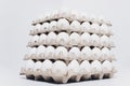 White eggs of a hen in harmless, cardboard packing on a white background. 5 packs. Royalty Free Stock Photo