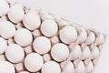White eggs of a hen in harmless, cardboard packing on a white background. 5 packs. Royalty Free Stock Photo