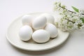 Fresh white eggs arranged on white plate with clean white background Royalty Free Stock Photo