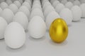 White eggs in a row with one golden egg Royalty Free Stock Photo