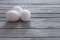 White eggs on wooden table