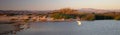 White egret flying over Santa Clara river jetty at Surfers Knoll in Ventura California USA Royalty Free Stock Photo