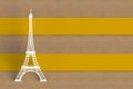 White eiffel tower on yellow wooden board