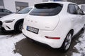 white electric car Ora Good Cat in winter parking lot, EV Great Wall Motors, technology and innovation in automotive industry,