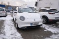 white electric car Ora Good Cat in winter parking lot, EV Great Wall Motors, technology and innovation in automotive industry,