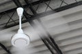 An electric ceiling fan in motion