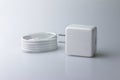 White electric charging with USB cable for phone on gray background Royalty Free Stock Photo