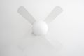 white electric fan with propeller on ceiling lamp indoors Royalty Free Stock Photo