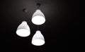 White electric light three lamps hanging on ceiling interior background Royalty Free Stock Photo